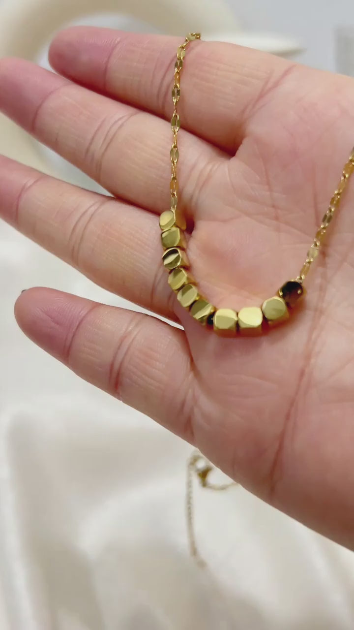 The Polished Geometric Cube Strand Necklace by Vexa